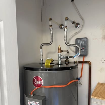 Rheem electric water heater install in a utility closet — Affordable Air Service