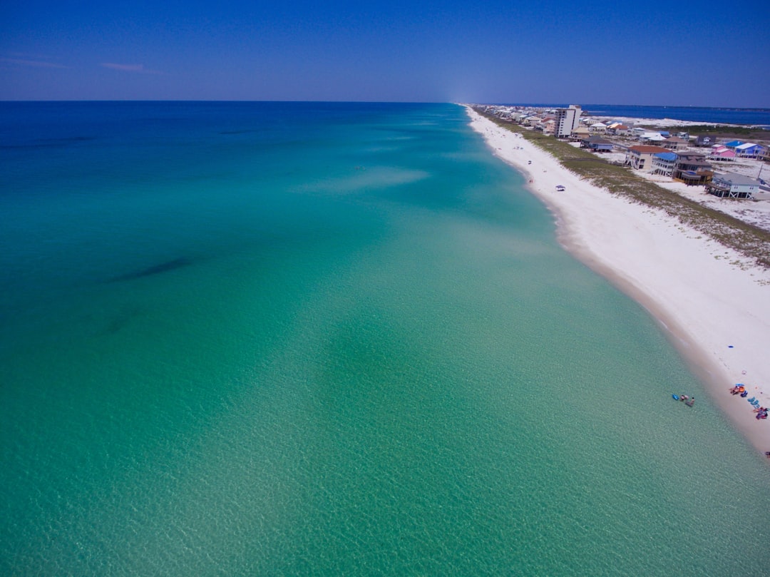 Blog 3 Emerald Coast shoreline with Gulf breeze and coastal homes - how emerald coast climate affects your hvac and plumbing