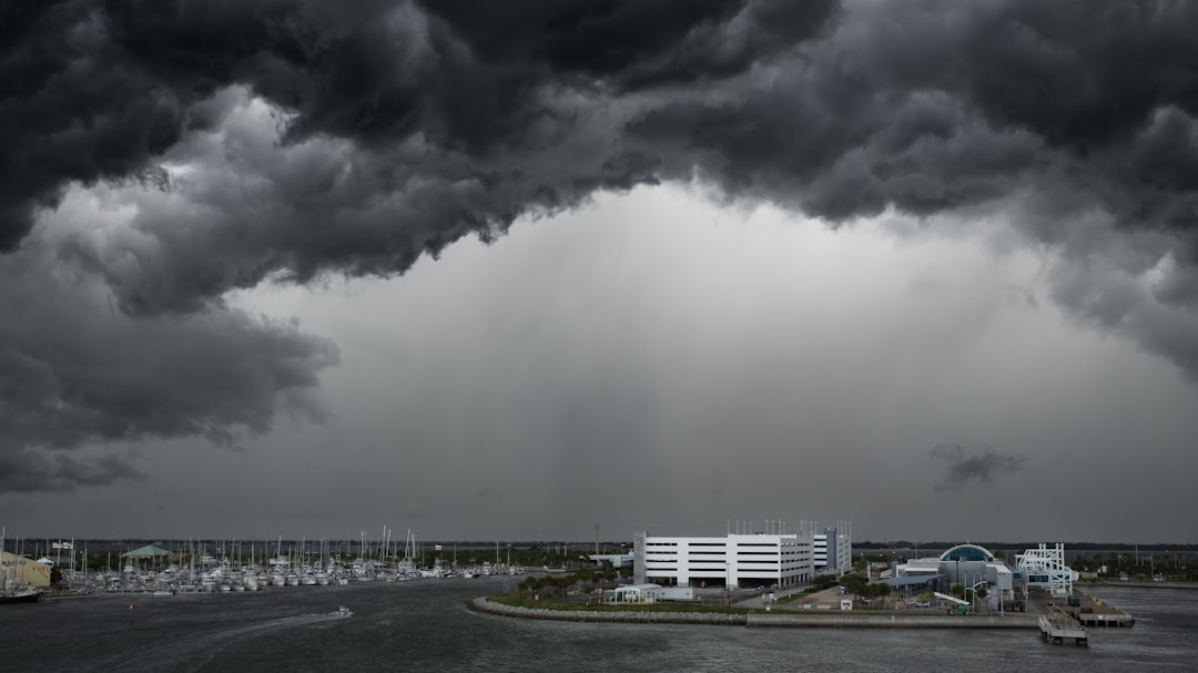 Blog 5 Florida spring thunderstorm approaching a residential neighborhood with dark clouds and lightning
