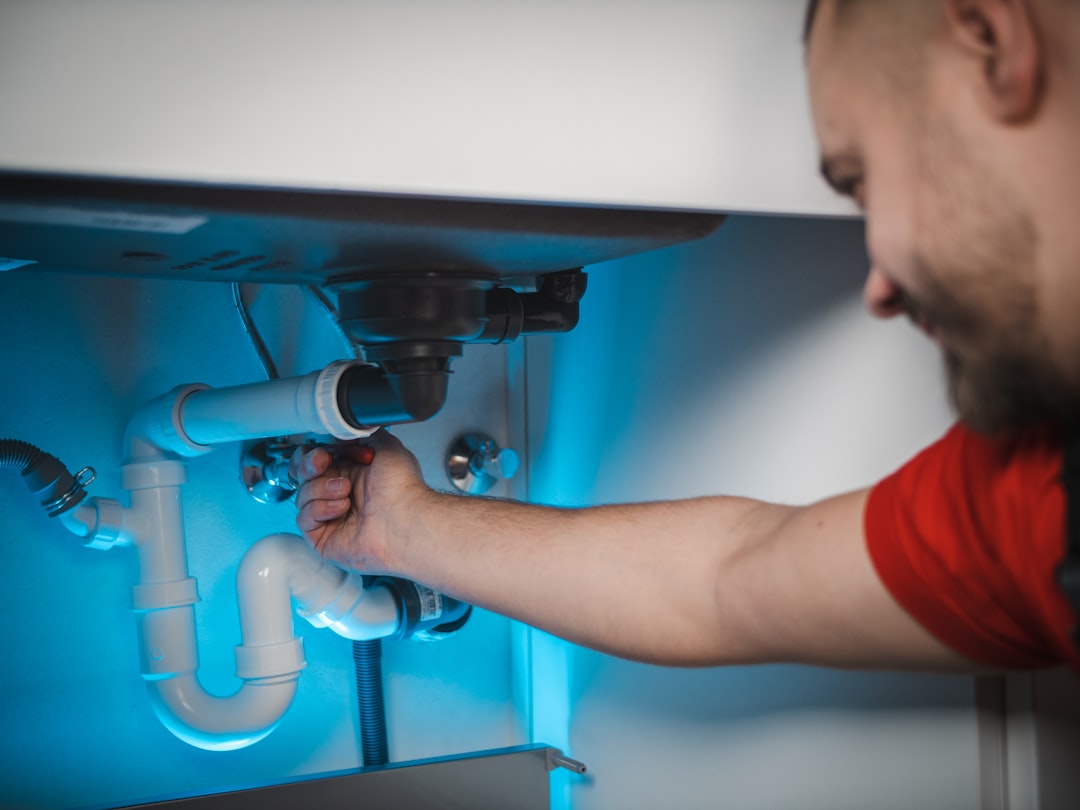 Blog 5 A professional plumber working on a residential pipe system in Santa Rosa Beach